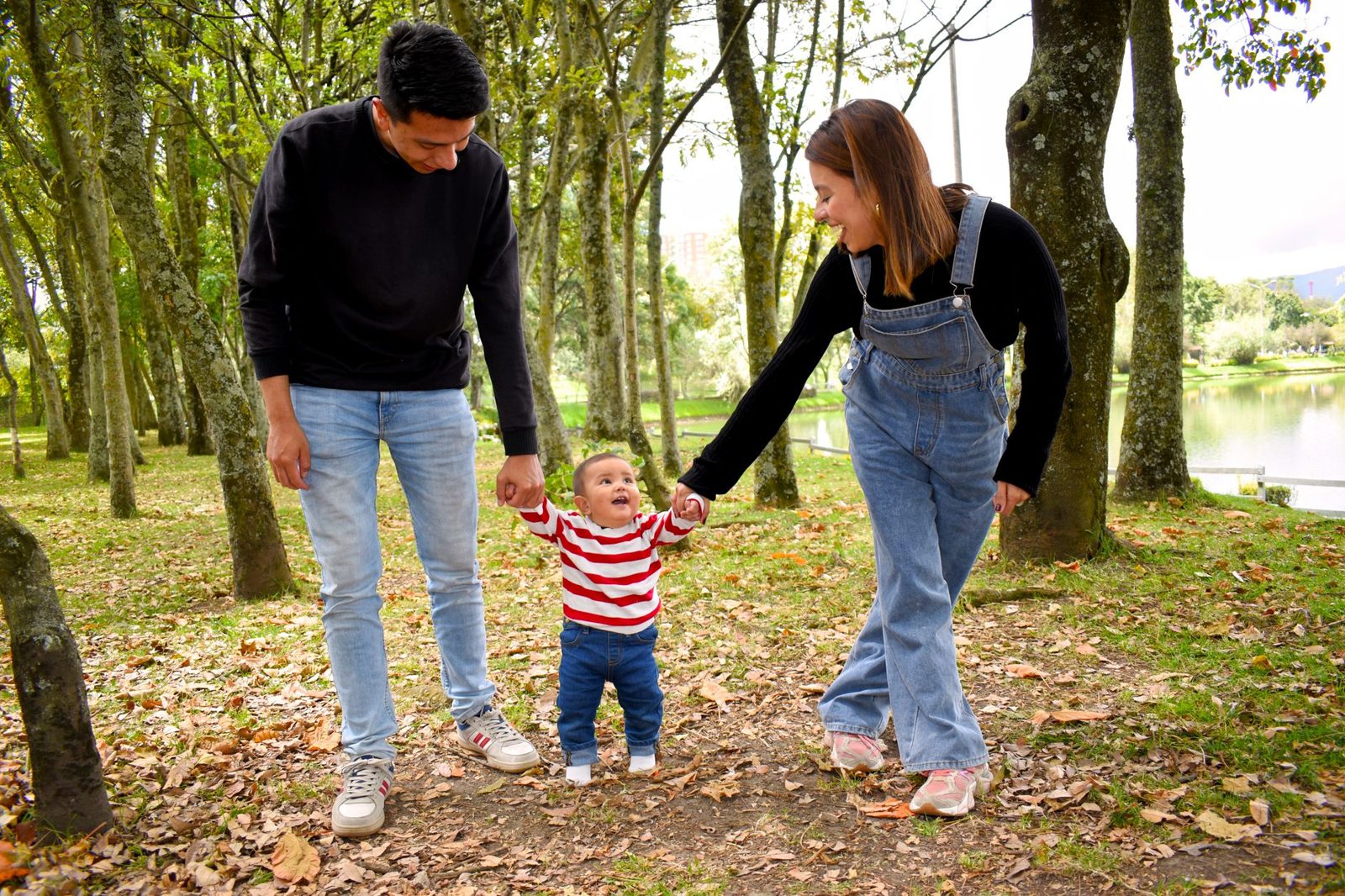 Parents walking hand in hand with their child